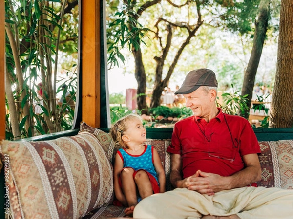 Fototapeta Man with granddaughter having fun