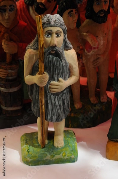 Obraz various traditional handmade wooden figurines with souvenirs are presented on the market