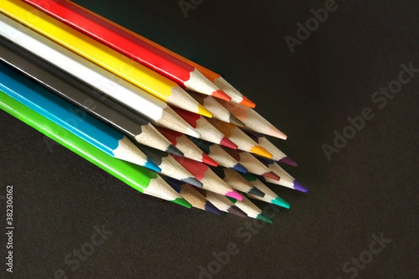 Obraz Colored pencils on a black background