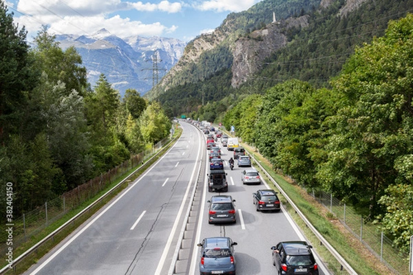 Obraz Rothenbrunnen, Switzerland: 12 August 2018 - Weekend traffic jam on the highway towards Swiss Alps creation regions, there is no contraflow in direction to metroplises.