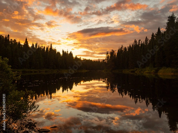 Obraz Beautiful view of trees and clouds reflecting in a lake, in Canada