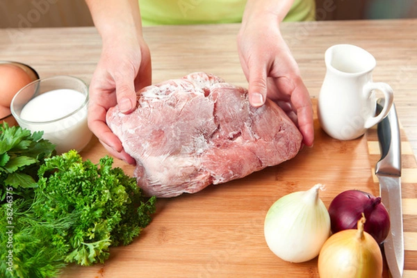 Obraz The frozen meat on a kitchen table.