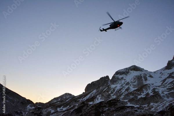 Obraz Helicopter rescue in the mountains