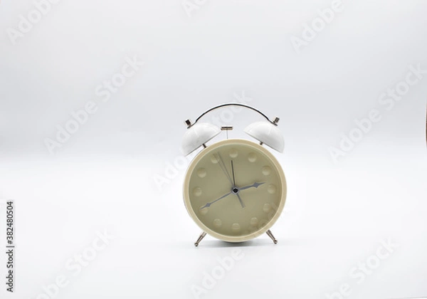 Fototapeta Antique clock in white color and with white background