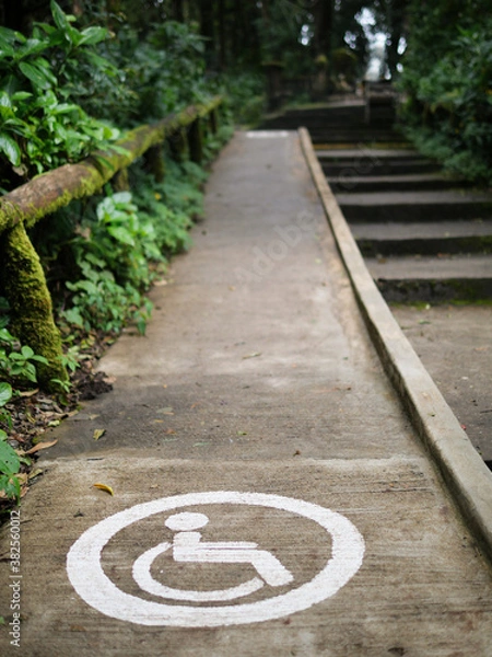 Obraz The wheelchair symbol on the way up to the hill