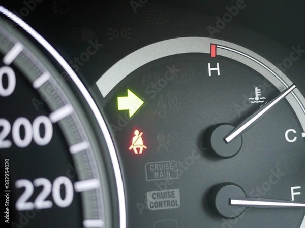 Obraz car turning signal light on car dashboard.
