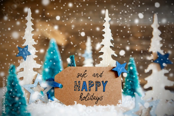 Obraz Label With Engllish Text Safe And Happy Christmas. White And Green Christmas Tree With Stars. Snow, Snowflakes And Wooden Background