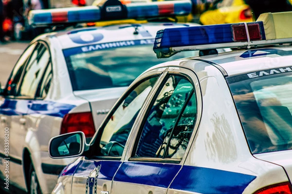 Obraz Closeup of an official police car patrolling the streets of the city center of the metropolitan area
