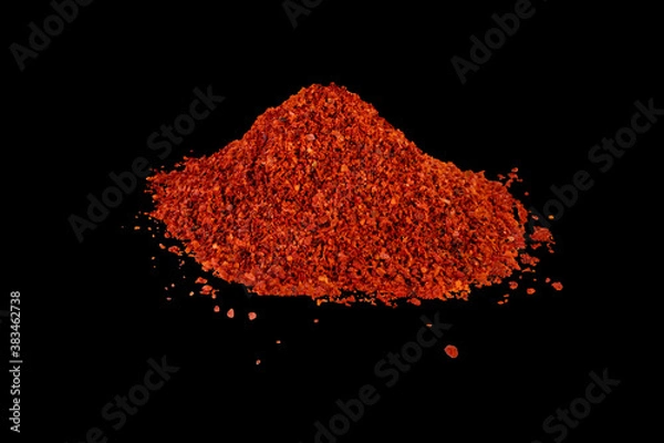 Obraz Heap of dried crushed hot red pepper on isolated black