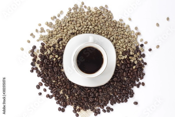 Fototapeta Black coffee is served in a glass cup, which is placed on a bamboo plate and sprinkled with neatly arranged coffee beans.