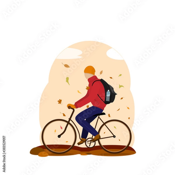 Obraz a young man rides a bicycle under a leaf fall. warm clothes in the fall
