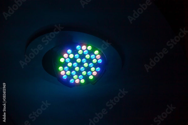 Obraz Colorful LED spot light mounted in ceiling