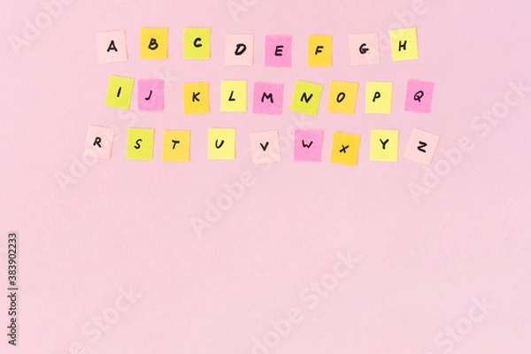 Obraz English alphabet completely. Multicolored pieces of paper with the letters on a pink background. Studying of foreign language. Start of the school training. Copy space, place for text.