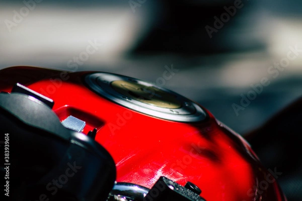 Obraz Closeup of a motorcycle parked in the streets of the city center of the metropolitan area
