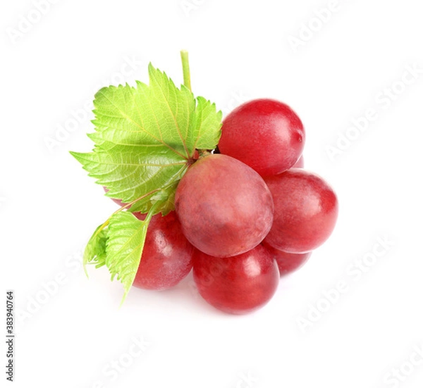 Fototapeta Bunch of red grapes with green leaves isolated on white