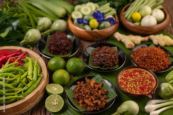 Obraz Different types of chili sauce in a cup with ingredients to make