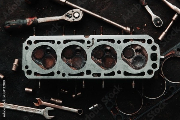 Obraz repair of an old engine car disassembled head and valves