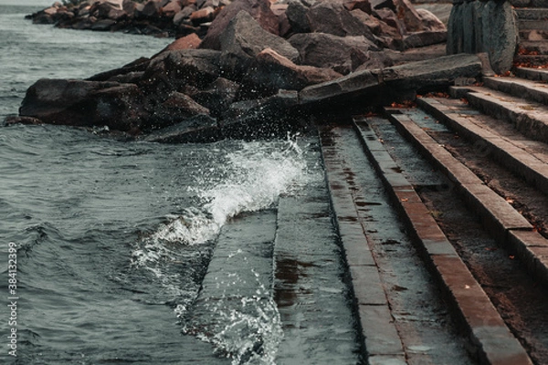 Obraz waves hitting stones on the shore in the black sea during a storm