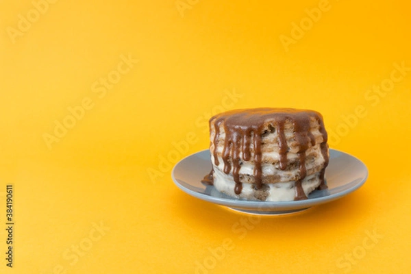 Obraz Chocolate cake with streams on a plate. Halloween concept, trick or treat. Handmade cooking, sweets with flows down. Orange background, copy space for text. Selective focus, blur.