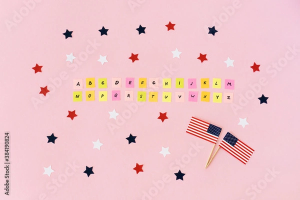 Obraz English alphabet completely. Flags usa and many red, white, blue stars around. Multicolored pieces of paper with the abc letters. Studying of foreign language. Concept take exams for green card.
