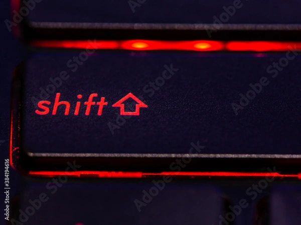 Obraz Black keyboard shift key with red backlight