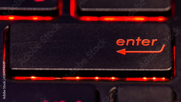 Obraz Black keyboard enter key with red backlight