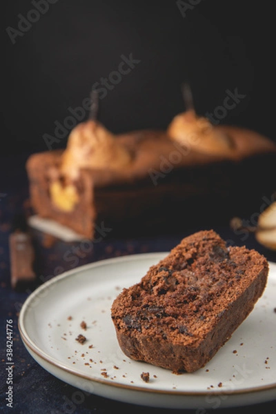 Obraz Homemade vegan chocolate cake with poached pears served on plate. Autumn cake.