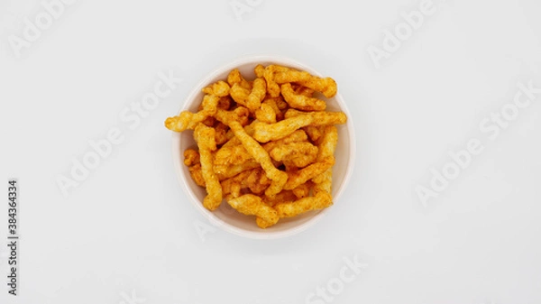 Obraz Healthy crunchy snack,Kurkure snack,Evening Snack or the Tea Snack,Kurkure is an evening snack that is manufactured using edible ingredients like rice meal, Background Texture