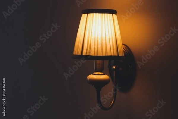 Obraz Luxurious lampshade with orange light on the wall