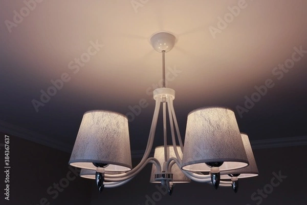 Obraz Chandelier in shades of white and silver with the lights on