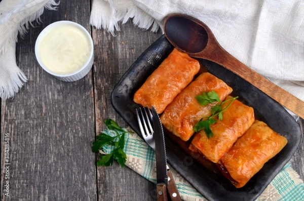 Fototapeta Cabbage rolls stuffed with ground meat and rice. Delicious homemade stuffed cabbage leaves with meat, rice and spices