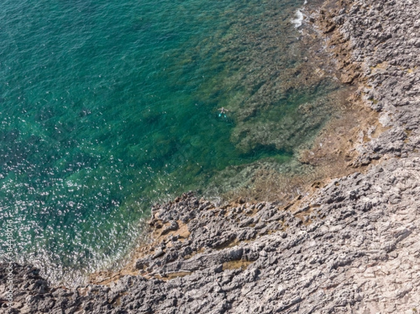 Obraz Aerial shot of the coastline of Capo Passero island and Portopalo town. Capo Passero is a small island in the southernmost Sicily, in front of the town of Portopalo, Italy