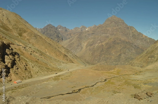 Fototapeta Driving through the windy mountain roads of the high Andes between Chile and Argentina