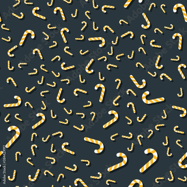 Fototapeta Pattern of yellow Christmas lollipop on a dark background. new year and christmas illustration. The template is suitable for posters, cards, fabrics or wrapping paper