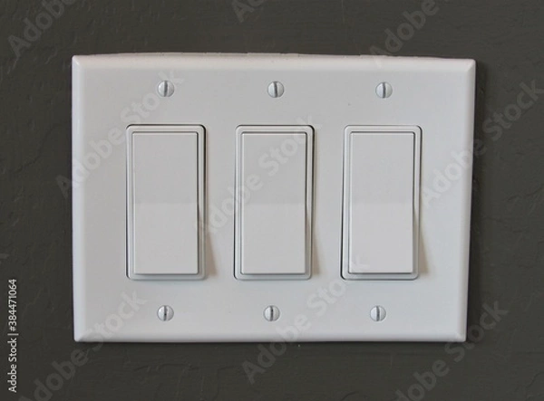 Obraz White modern light switch set on a painted interior wall