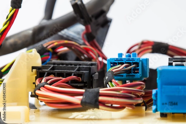 Obraz A cable of matted wires of different colors with connectors in the electrical wiring of the car. Internet line in the work of the provider.