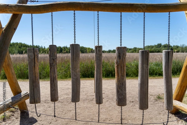 Fototapeta Wooden carillon (chime) on a playground in a park area