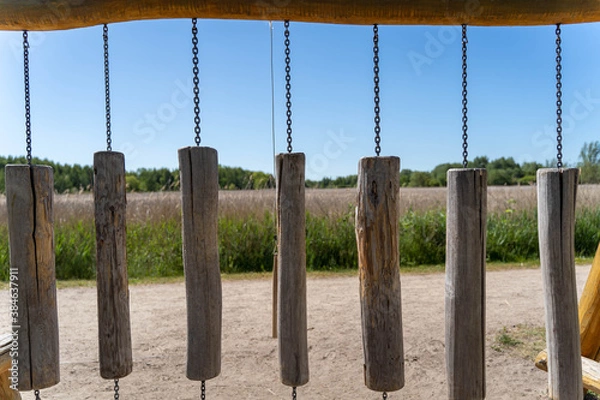Fototapeta Wooden carillon (chime) on a playground in a park area