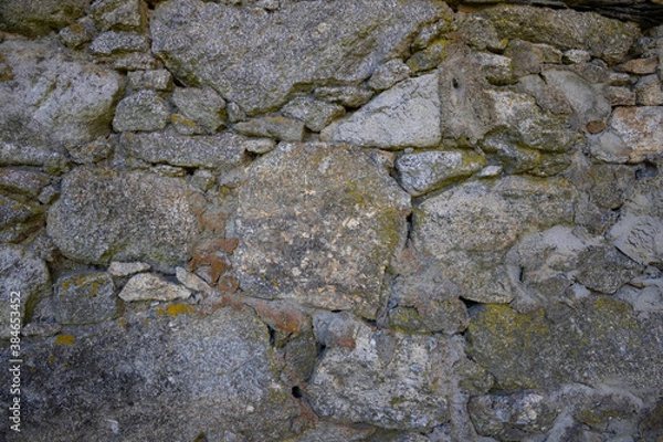 Fototapeta a old stone wall close up
