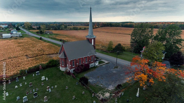 Fototapeta Cold air landscapes of rural scenes depicting barns and abandoned homes in fall colour settings around the South East of Ontario Canada in The Greater Napanee and Stone Mills township.