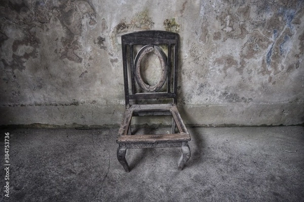 Obraz old chair on the wall
