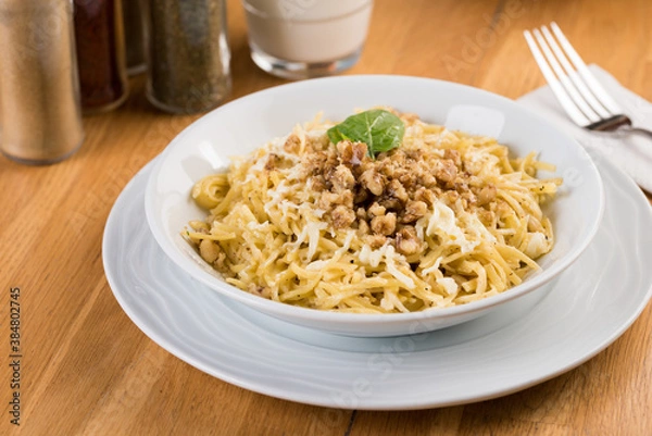 Obraz Turkish Noodle / Eriste with cheese, walnuts on wooden background