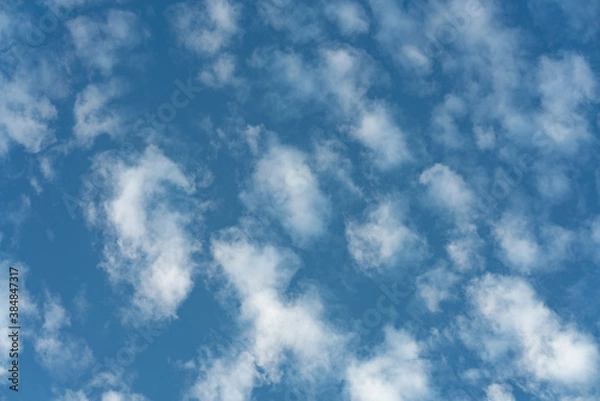 Obraz Beautiful small white clouds floating across the blue sky
