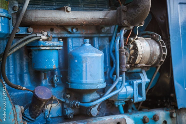 Fototapeta A closer look at an old tractor engine.