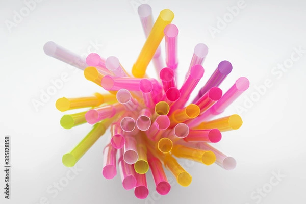 Fototapeta Colored plastic drinking straws on white background