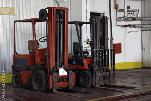 Obraz Two forklifts in warehouse