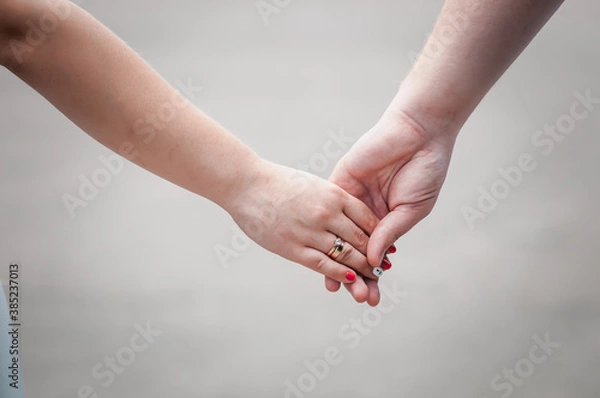 Fototapeta hands of newlyweds with wedding rings