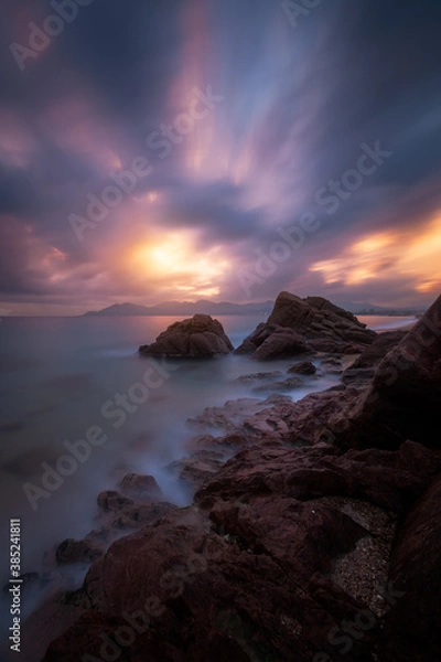 Fototapeta Epic cloudy sunset above the coastline of Cannes