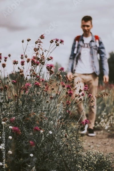 Obraz child playing with flowers
