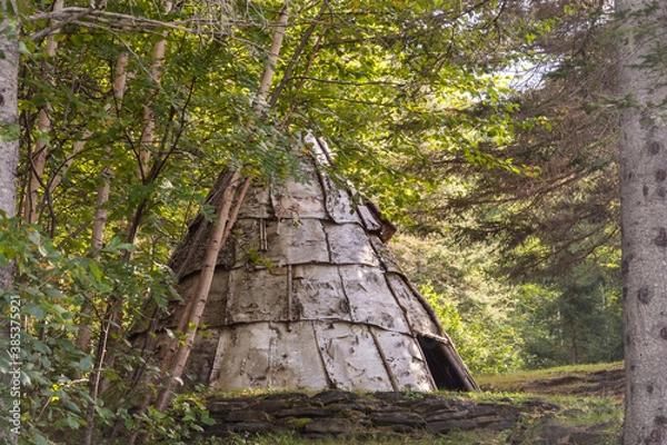 Obraz View of a traditional wooden tipi in Canada